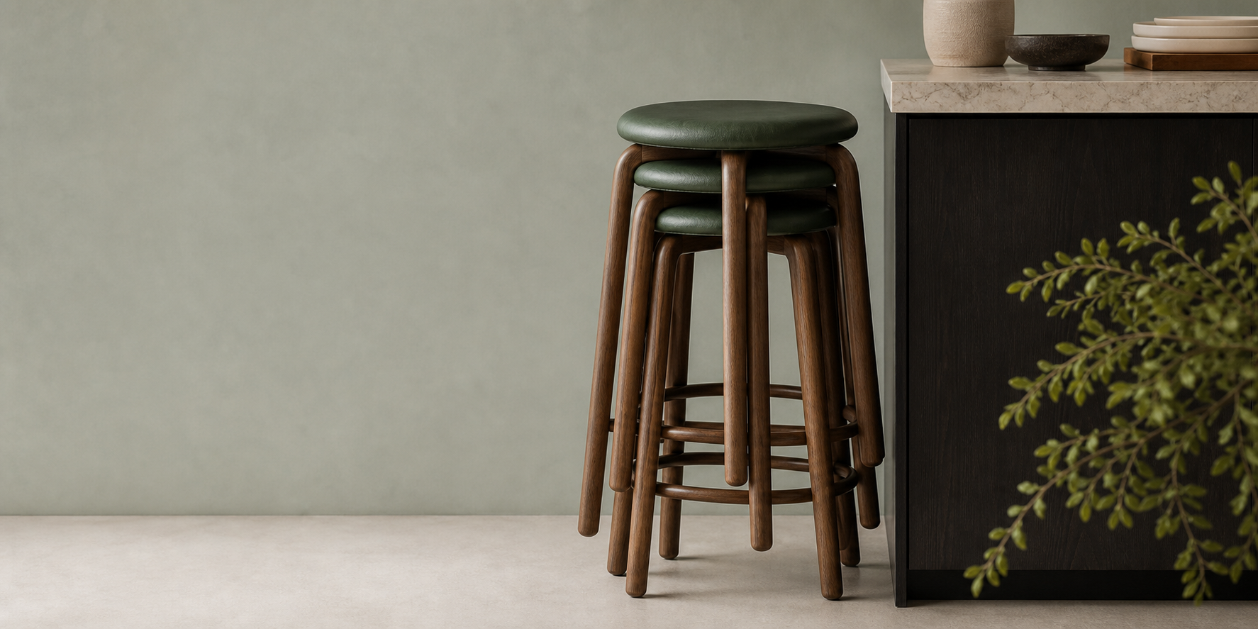 Stacked counter stools beside a kitchen cabinet